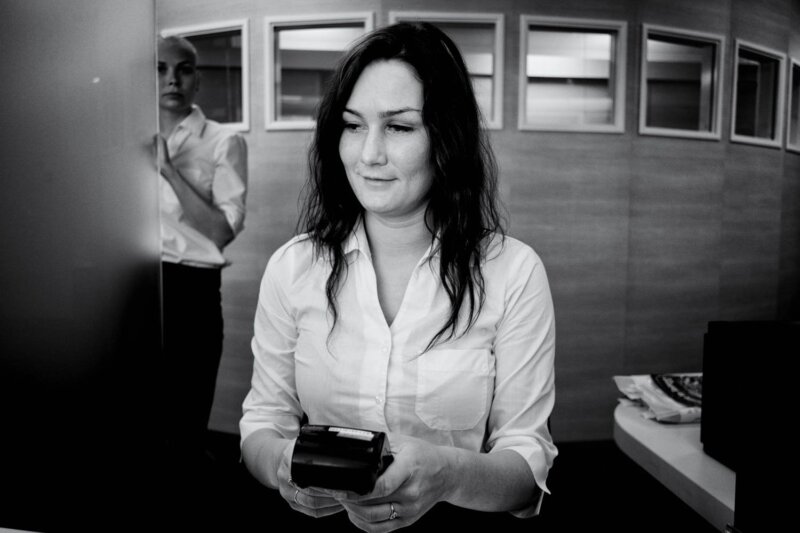 Main Subject: A woman Visual Elements: The image is a photograph with a portrait orientation, captur